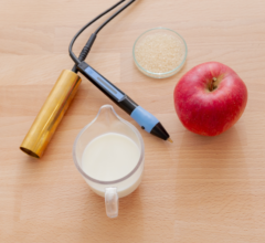 Petrischale, Milch, Apfel und Gerät für Elektroakupunktur nach Voll (EAV)